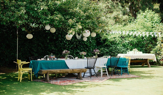 Picture of a table ready for a Summer gathering under the trees in the garden