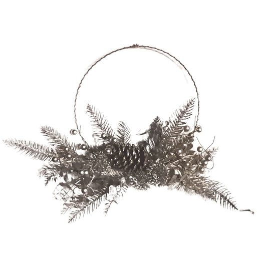 Decorative wreath with ferns and pinecones on a white background