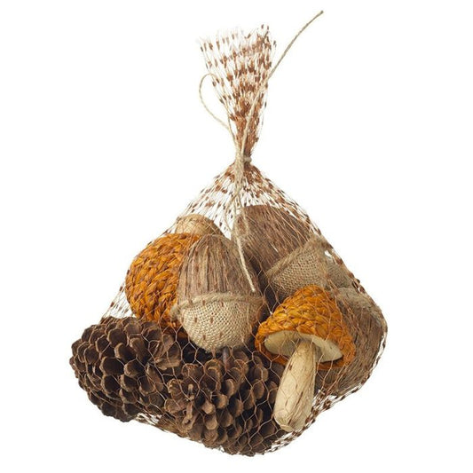 Bag of decorative woodland items including pinecones, toadstools and acorns in a net bag on a white background