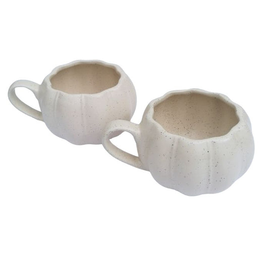 Two ceramic cups with a textured surface on a white background