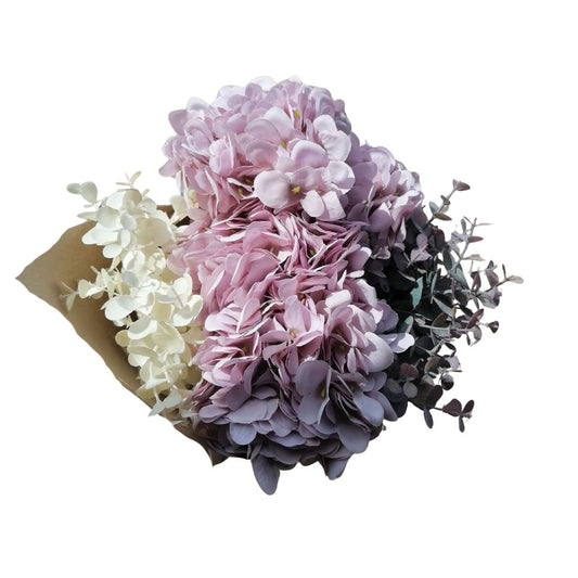 Bouquet of lilac and white flowers with greenery on a white background