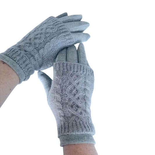 Showing the top cable knit pattern on the top of the 3 in 1 multi style silver grey gloves being worn on models hands
