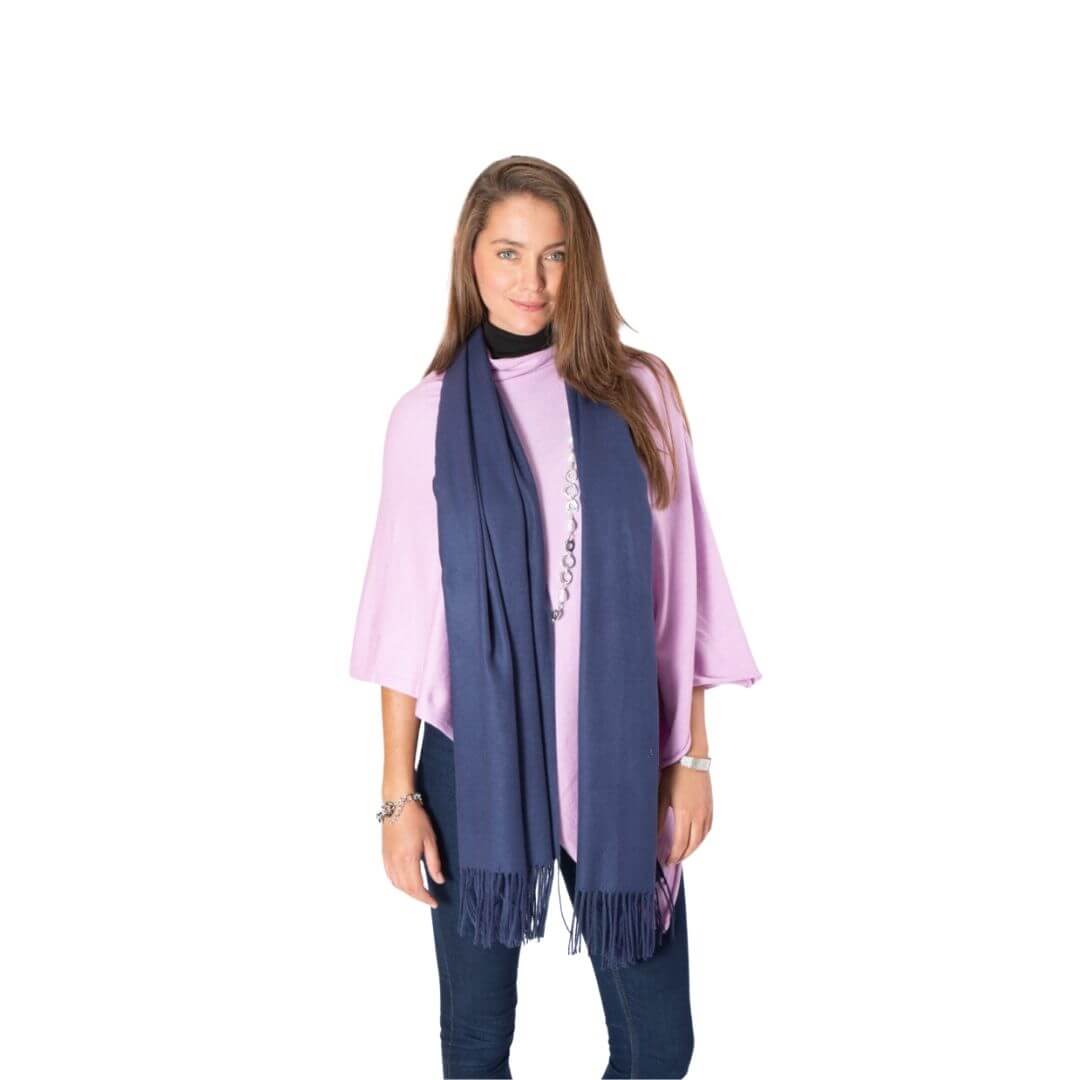 Deep blue long pashmina scarf shawl with fringe draped over moodel's shoulders