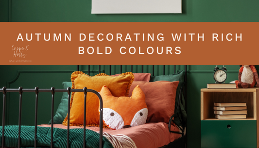 Autumn Decorating with rich bold colours blog post cover, with dark green painted walls, black iron metal bed, and deep orange velvet and a fox cushion lying on the bed w