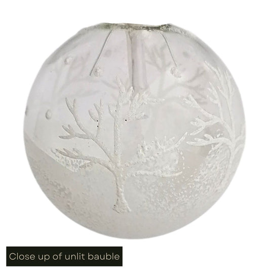 White cut out image of a close up of the bauble pattern on the winter scene battery operated lights