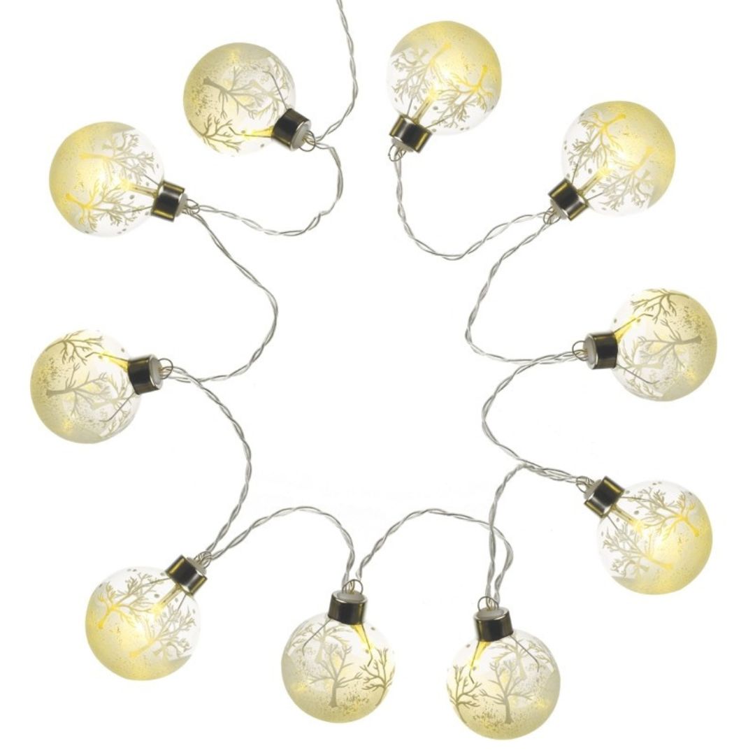 White cut out image of the string of 10 bauble shaped winter scene battery operated lights switched on, showing the warm white light effect