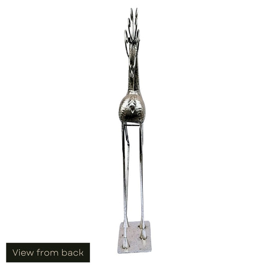 White cut out image showing the view from the back of the antique silver-effect hammered metal floor-standing stag