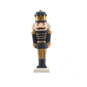 Gold and navy blue Christmas nutcracker soldier, standing with hands by his side