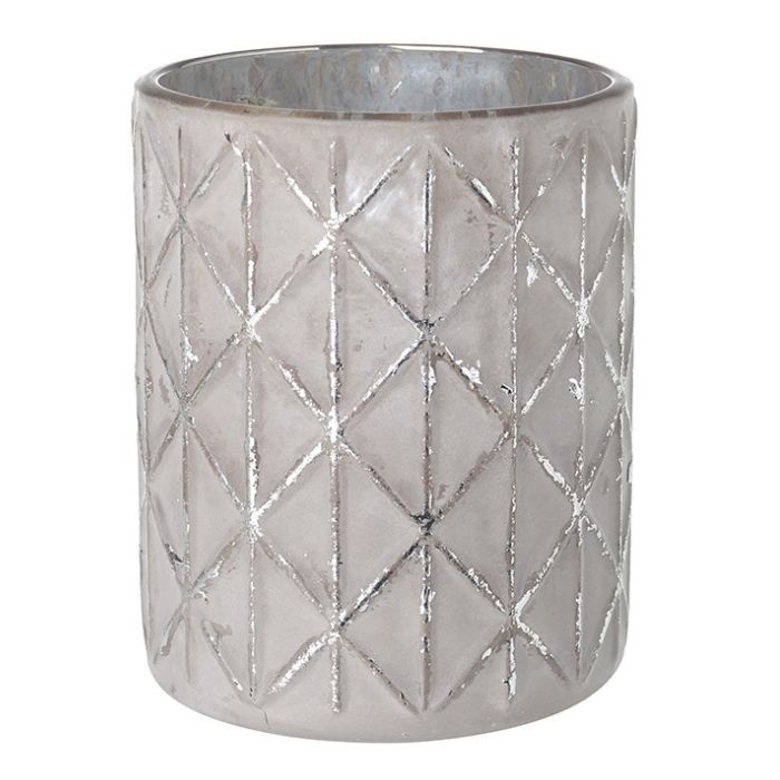 Decorative glass votive candle holder with geometric pattern on a white background