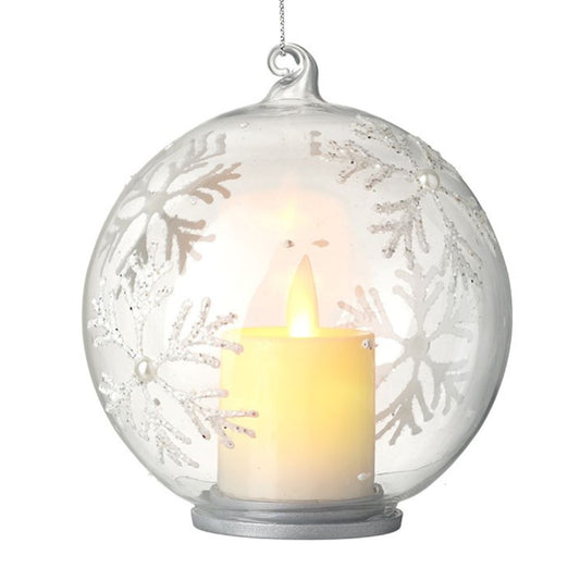 Decorative glass ball with a candle inside on a white background