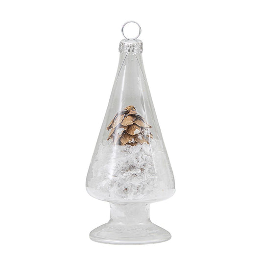 Clear glass Christmas tree ornament with pine cones and snow-like material on a white background