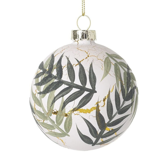 Decorative glass ball with leaf pattern and gold accents on a white background