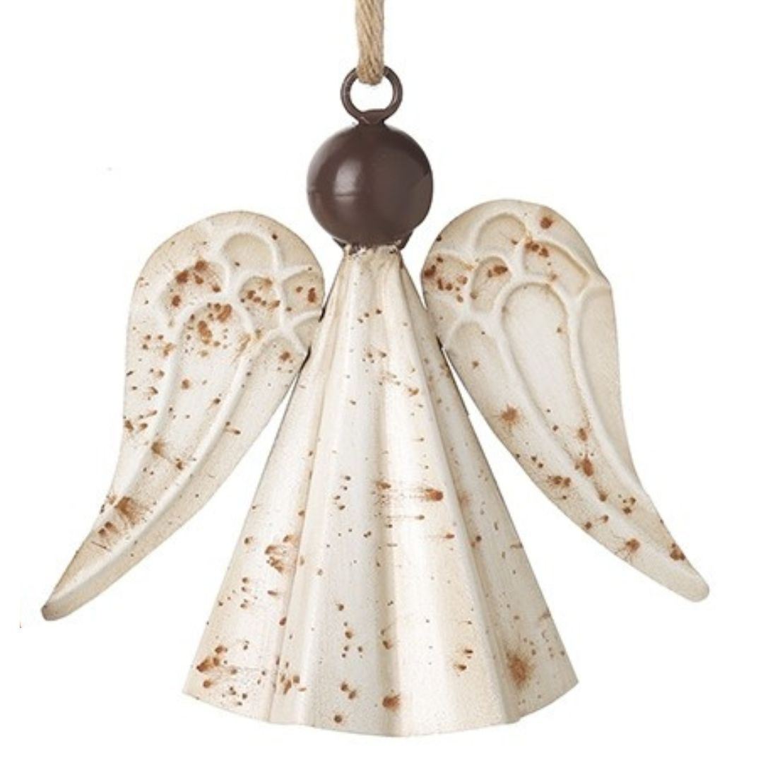 Decorative angel ornament with rust spots on a white background