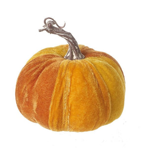 Velvet fabric covered pumpkin in shades of orange, with a plastic gnarled stump on the top
