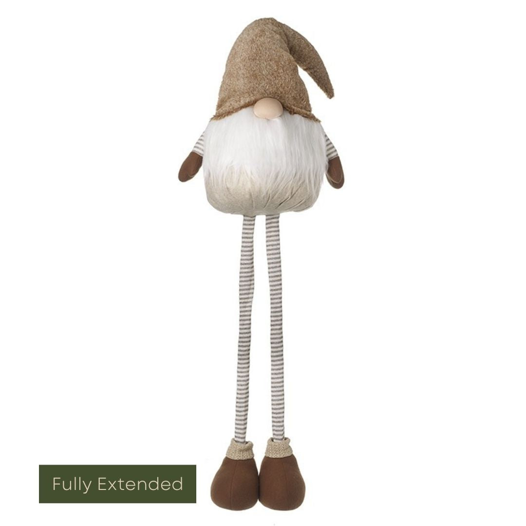 Stuffed gnome with a brown hat and white beard on a white background