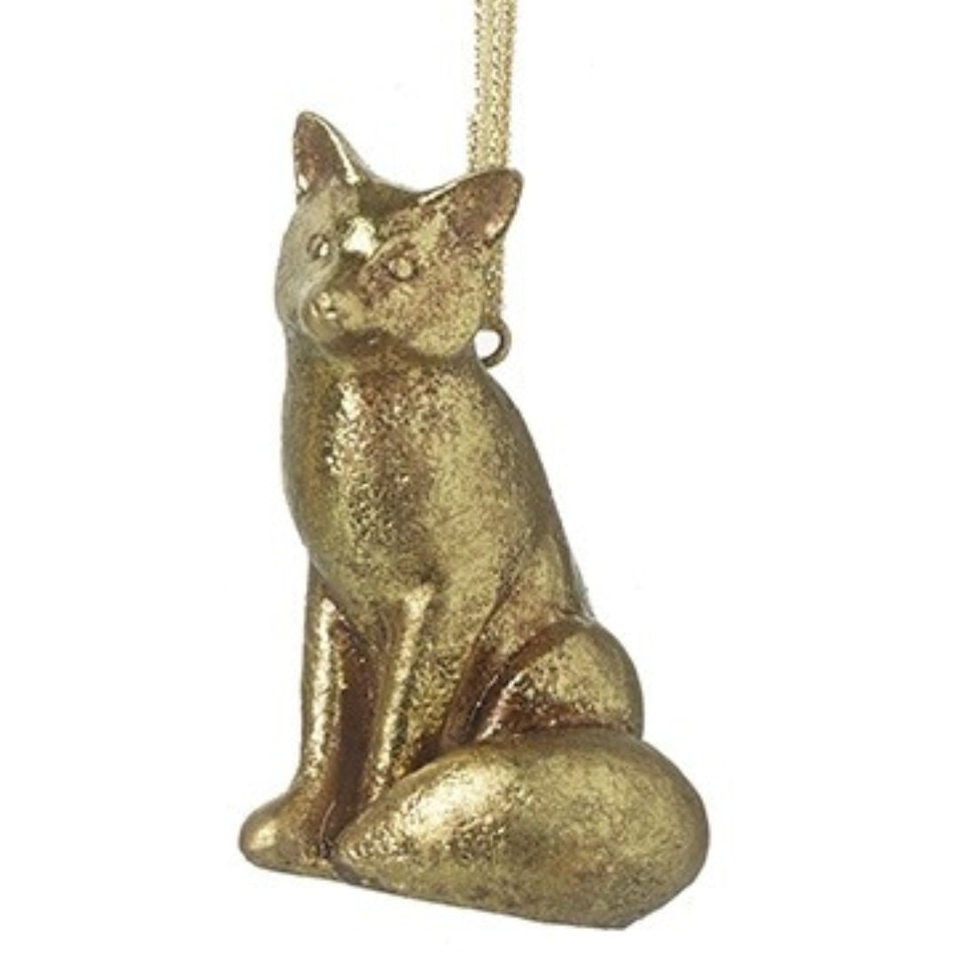 Gold fox-shaped hanging ornament on a white background