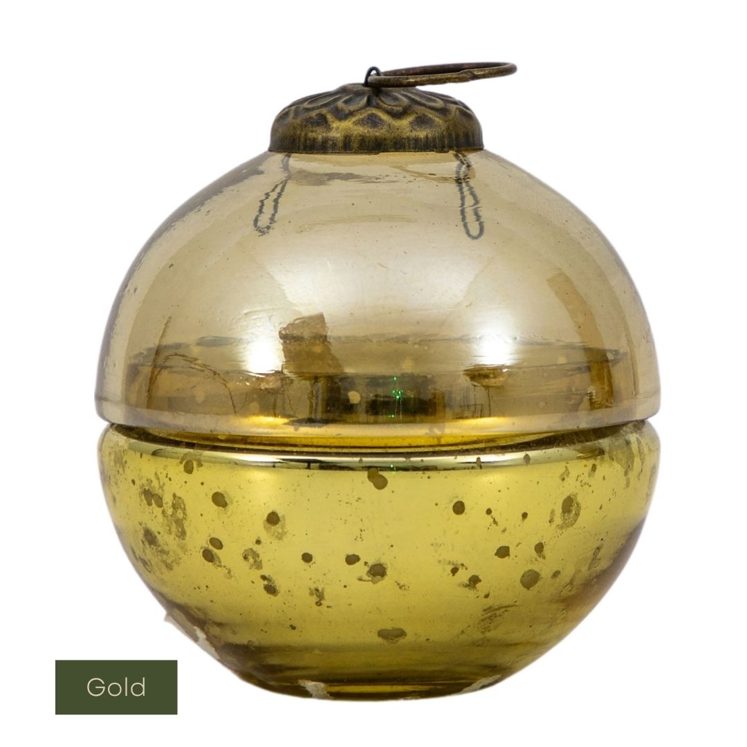 Gold candle holder with a lid on a white background