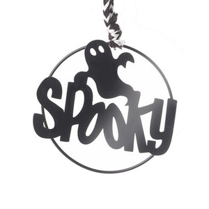 Spooky Halloween hanging sign wiht the text across the middle and a ghost floating above.  Finished off with a black and white twine style rope