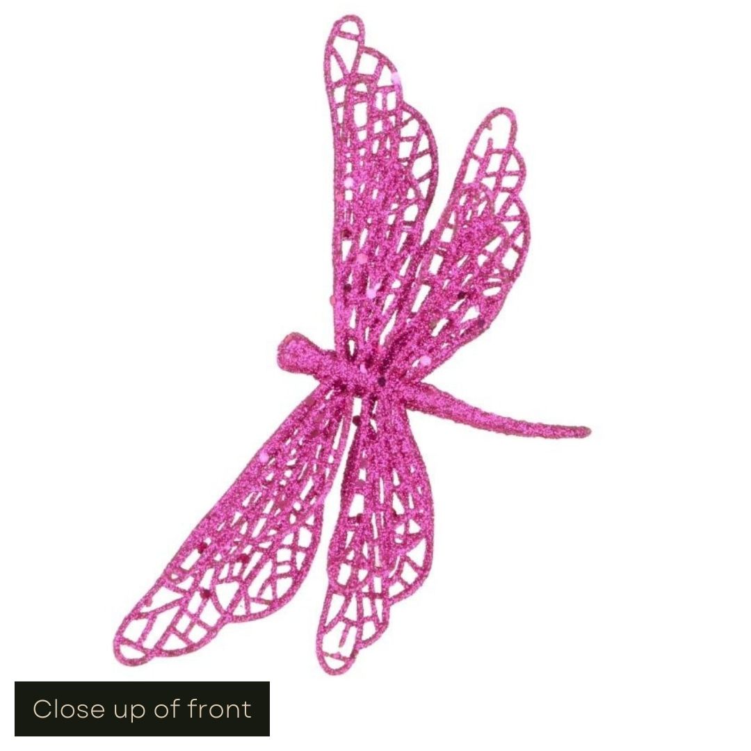 White cut out image showing a close up of the hot pink glittered butterfly clip on decoration from the front