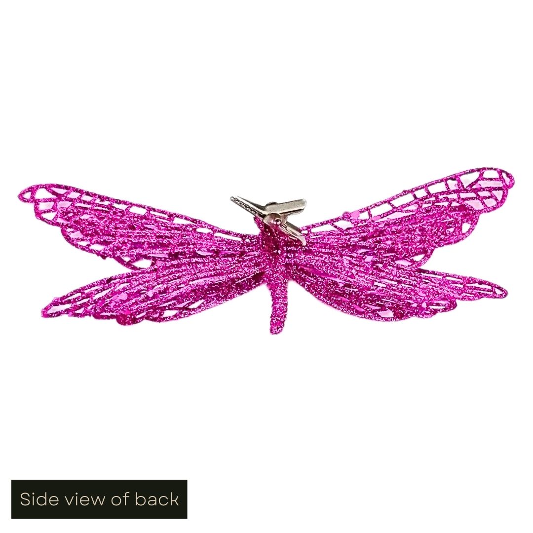 White cut out image showing the side view of the hot pink glittered butterfly clip on decoration, including an angled view of the clip