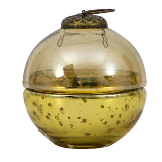 Vintage-style gold glass bauble candle with a decorative lid on a white background