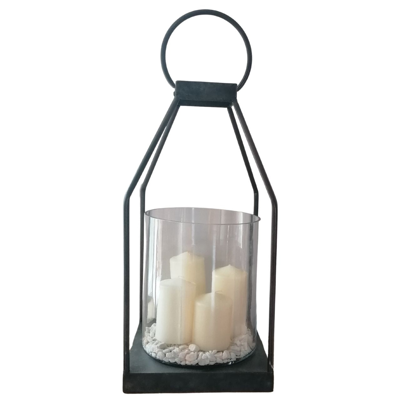 Black lantern with white candles inside on a white background