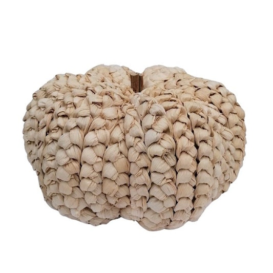 Beige woven pumpkin on a white background