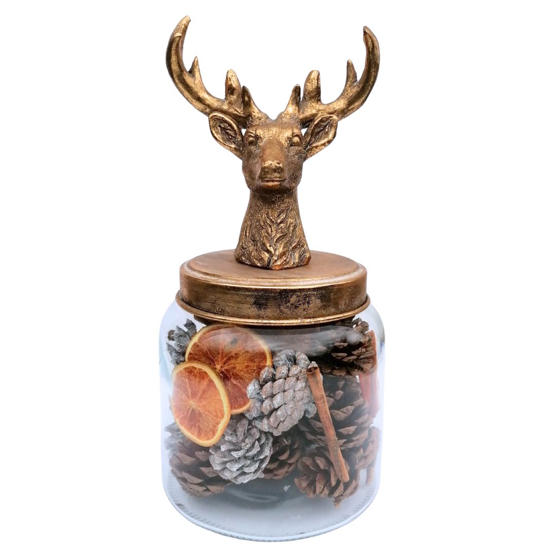 Stag head storage jar filled with potpourri made up of cones, cinnamon sticks and orange slices