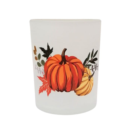 White candle holder with pumpkins and leaves on a white background