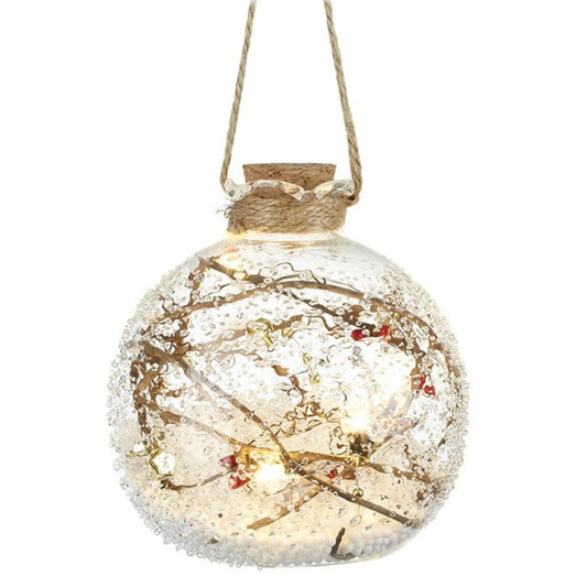 Decorative glass ball with LED lights and twigs on a white background