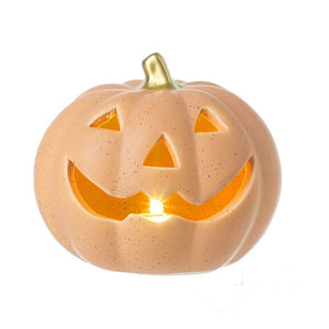 Light up ceramic pumpkin carved in a jac-o-lantern style with a painted gold stalk.  The light shines through the face