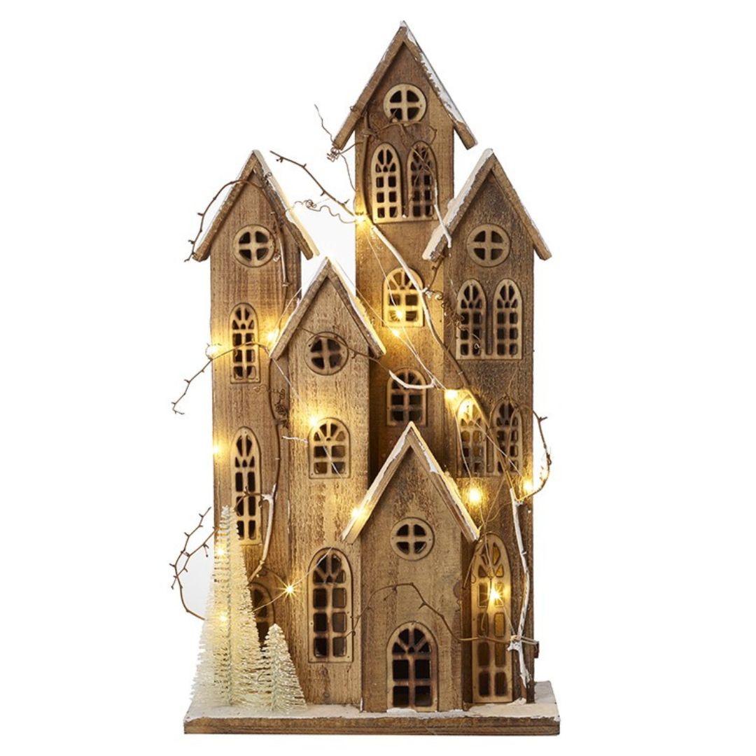 Wooden house-shaped decorative light with string lights on a white background