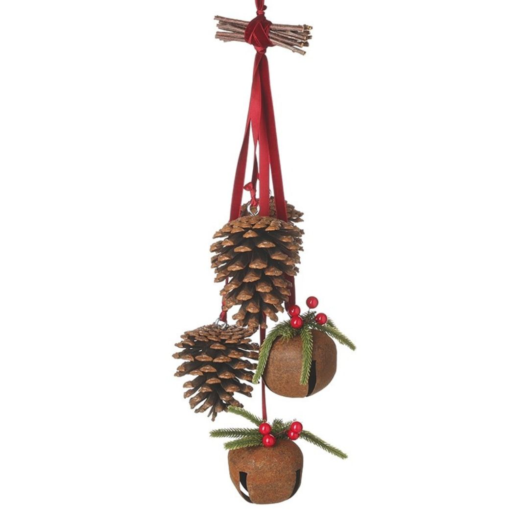 Decorative hanging ornament with pine cones, berries, and a red ribbon on a white background