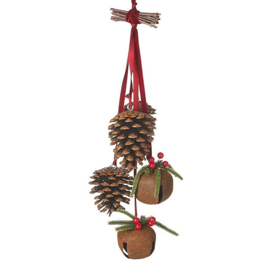 Decorative hanging ornament with pine cones, berries, and a red ribbon on a white background