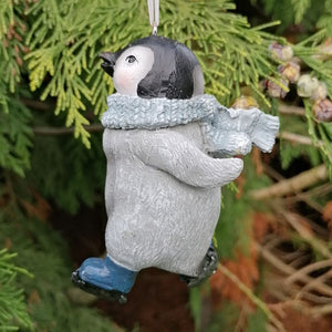 Penguin Christmas ornament wearing a light blue scarf