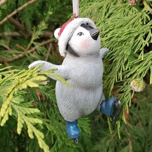 Penguin Christmas decoration wearing a red and white hat