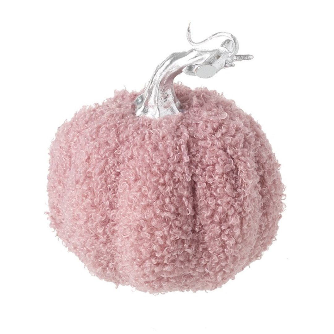 The blush pink fabric pumpkin showing the silver stalk on the top, and the bobbly effect of the fabric
