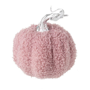 The blush pink fabric pumpkin showing the silver stalk on the top, and the bobbly effect of the fabric