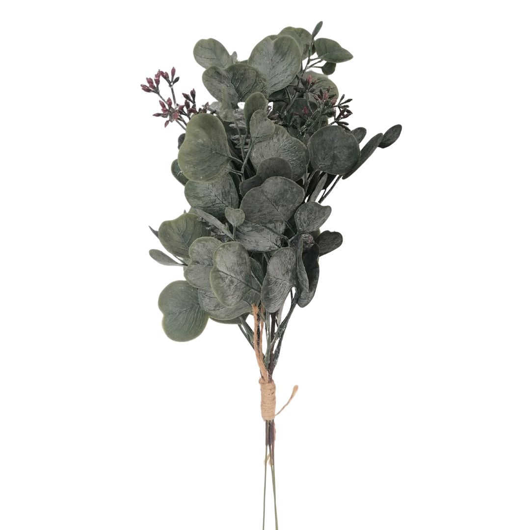 Bouquet of green leaves tied with twine on a white background