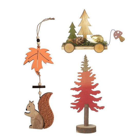Set of wooden ornaments including a squirrel, leaf, and trees on a white background
