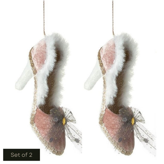 White cut out image showing the set of 2 blush pink velvet shoe hanging decorations.  These have white fur around the rim of the shoe, and the heel is white material.  The inside of the shoe is pale gold litter.