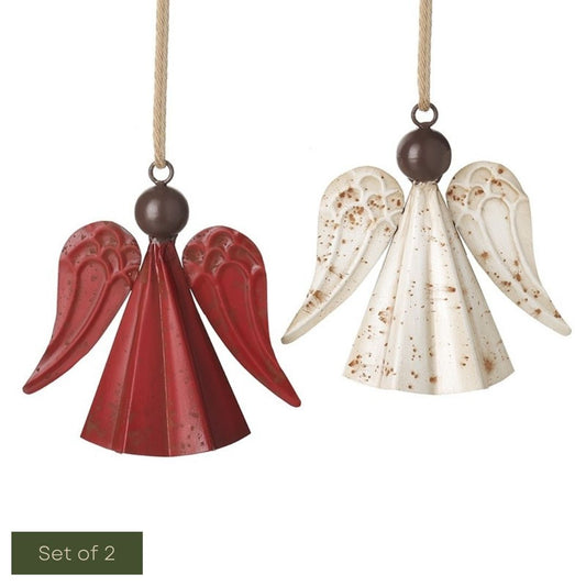 Two angel ornaments, one red and one with speckled pattern, on a white background.