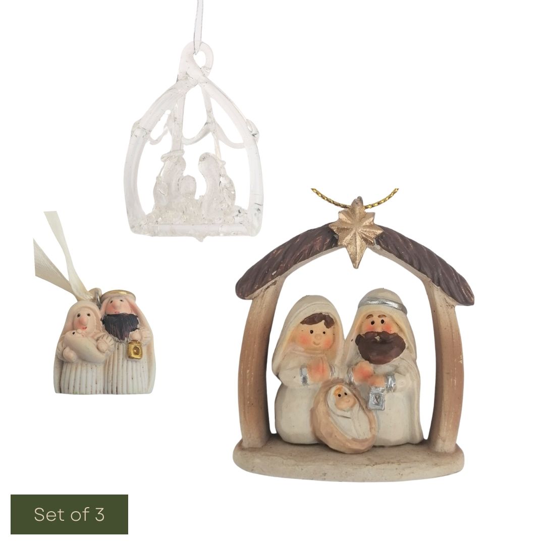 Set of three nativity scene figurines with a star and manger on a white background.