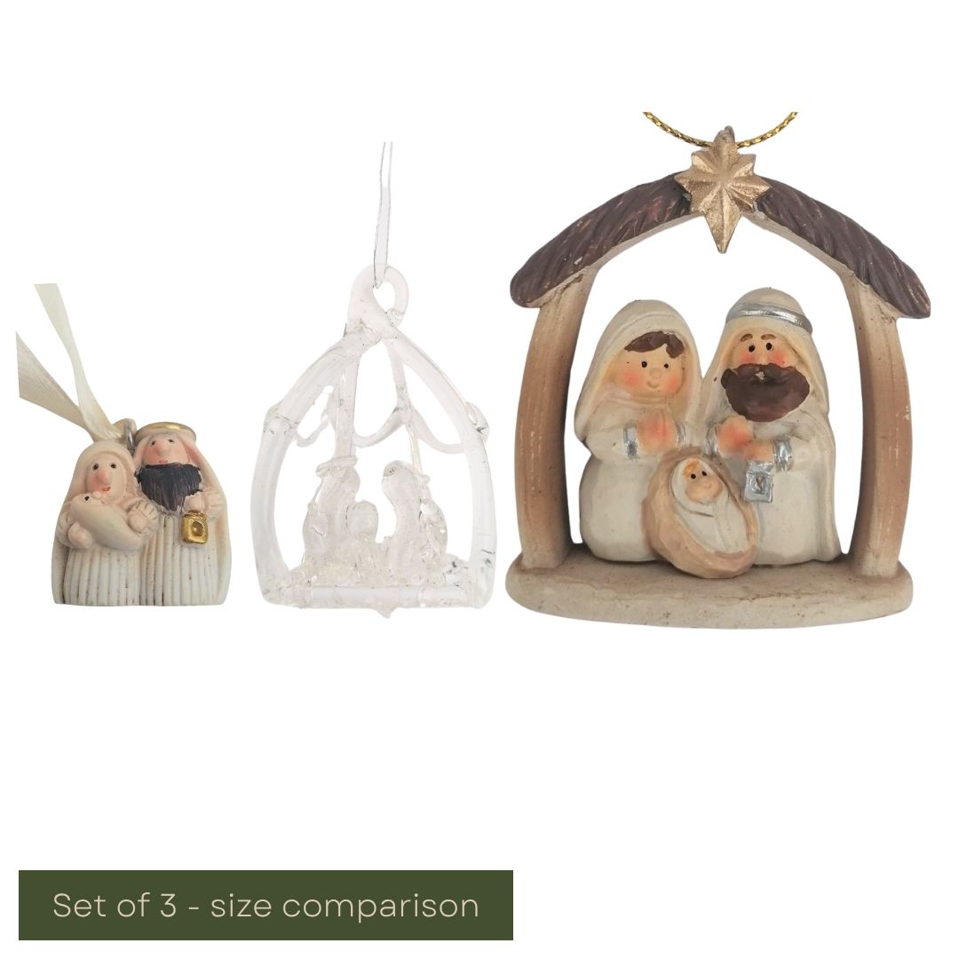 Set of three nativity scene figurines with size comparison on a white background