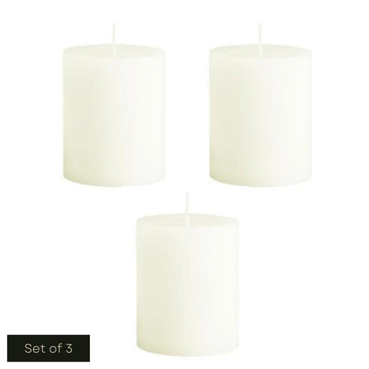 White cut out product image showing the set of 3 short ivory fragrance-free pillar candles