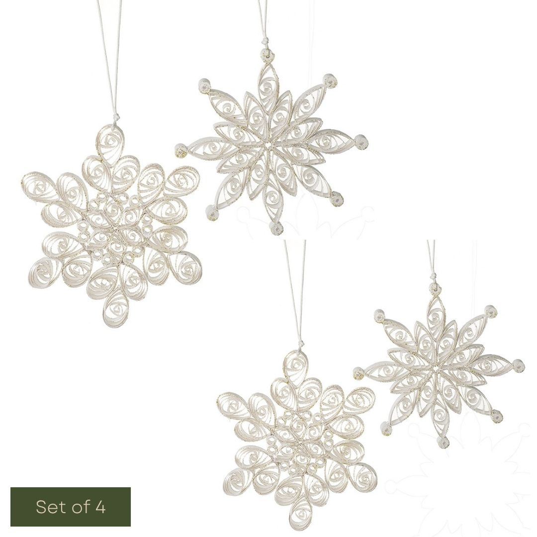 Set of four decorative snowflake ornaments on a white background