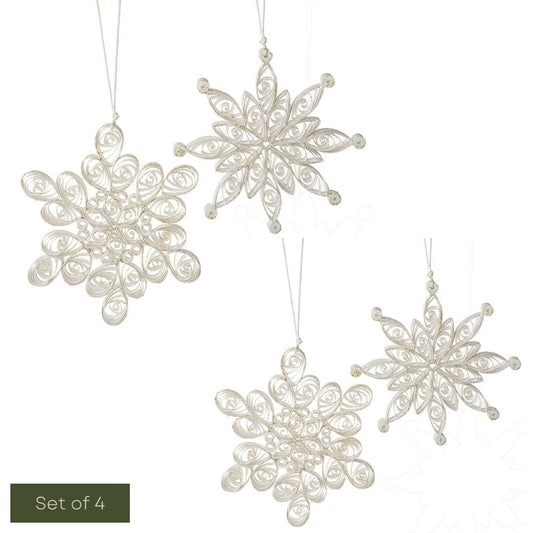 Set of four decorative snowflake ornaments on a white background