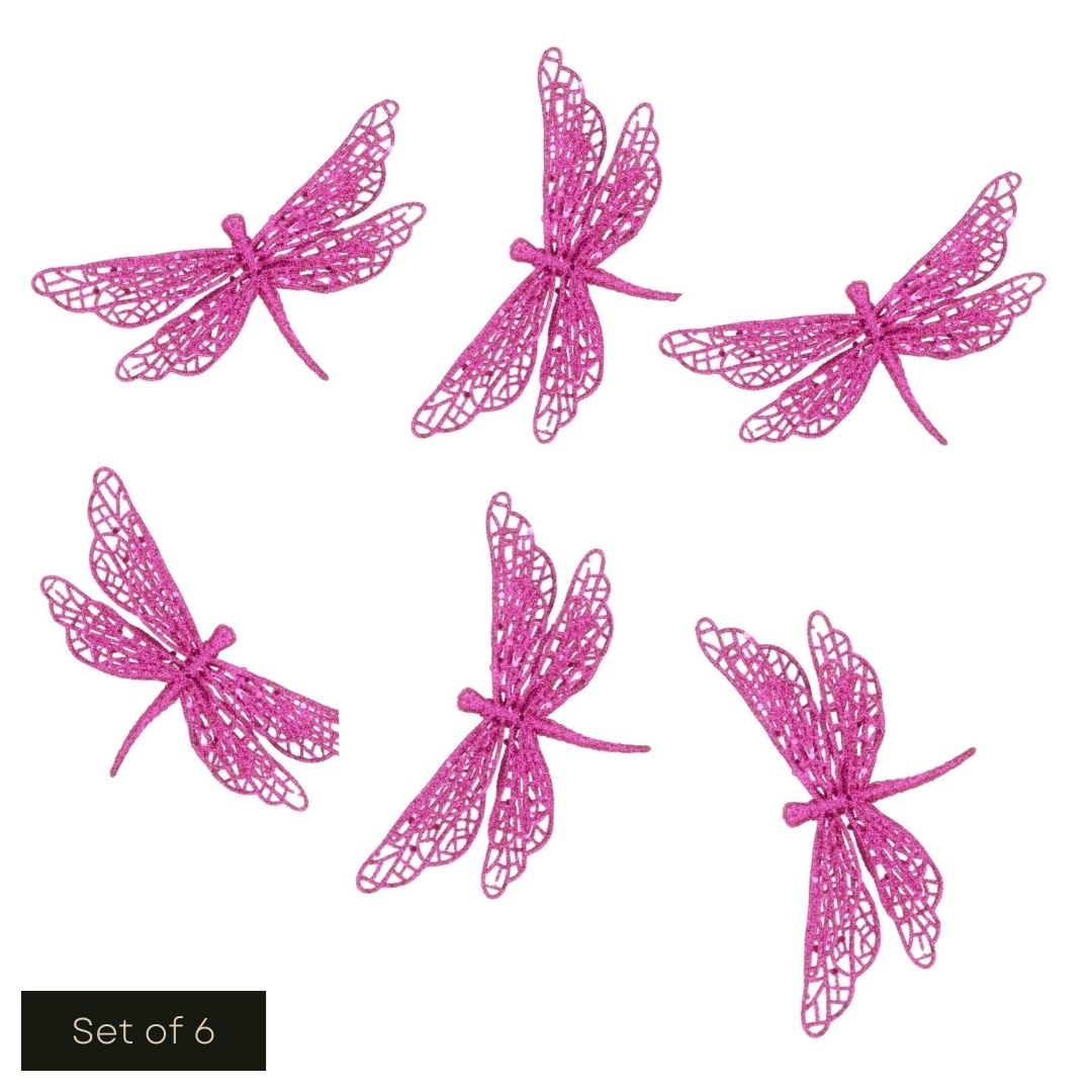 White cut out product image showing 6 hot pink glittered butterfly clip on decorations arranged on the page