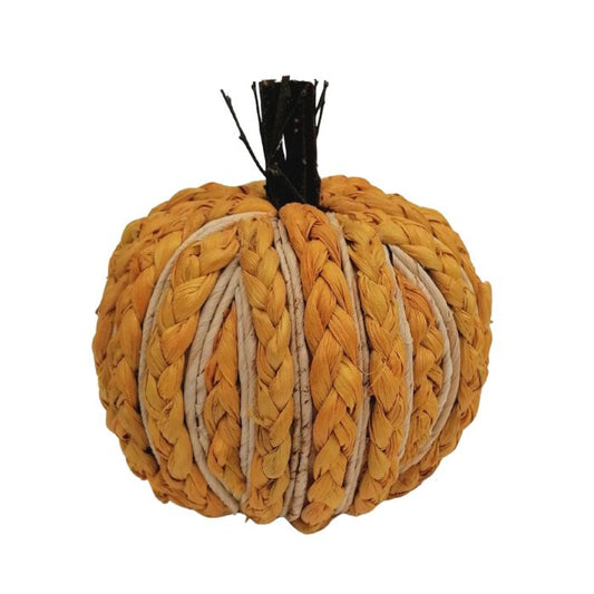 Woven pumpkin decoration on a white background