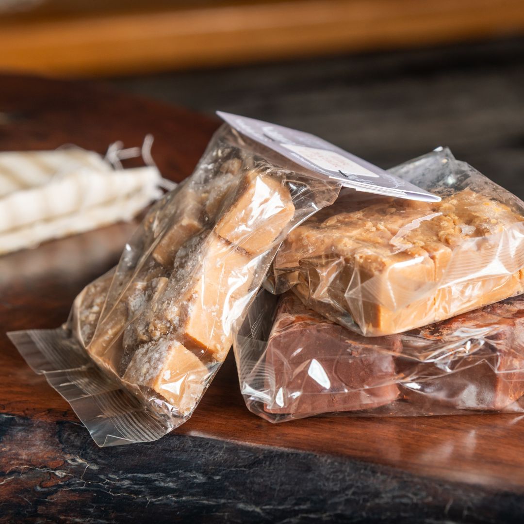 Packaged fudge on a wooden surface